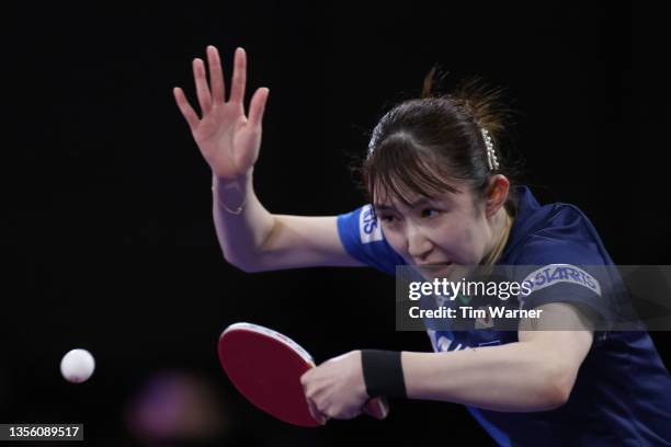 Hina Hayata of Japan plays a shot against Qian Tianyi and Chen Meng of China during the women's doubles semifinals match of the 2021 ITTF World Table...