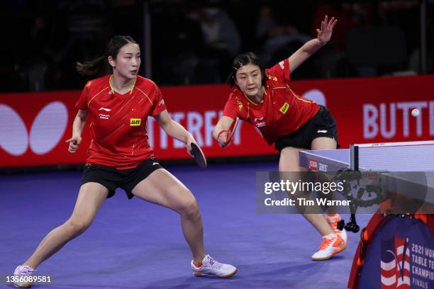 Qian Tianyi and Chen Meng of China in action against Mima Ito and Hina Hayata of Japan during the women's doubles semifinals match of the 2021 ITTF...