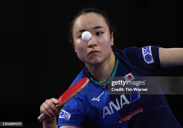 Mima Ito of Japan serves against Qian Tianyi and Chen Meng of China during the women's doubles semifinals match of the 2021 ITTF World Table Tennis...