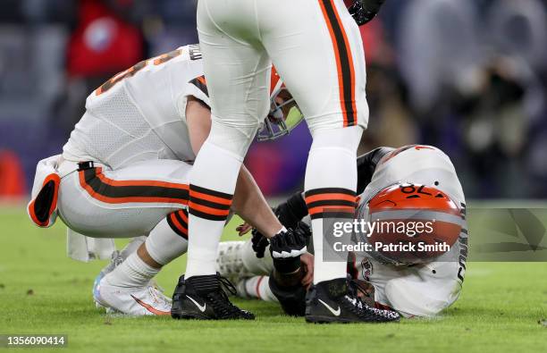 Jack Conklin of the Cleveland Browns is injured during a game against the Baltimore Ravens at M&T Bank Stadium on November 28, 2021 in Baltimore,...