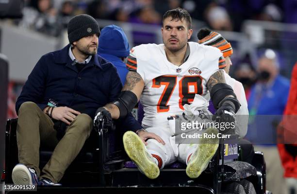 Jack Conklin of the Cleveland Browns is injured during a game against the Baltimore Ravens at M&T Bank Stadium on November 28, 2021 in Baltimore,...