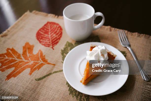 slice of pumpkin pie - pumpkin pie stock pictures, royalty-free photos & images