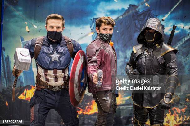 Cosplayers Matt Mullis as Captain America, Jake Garabedian as Starlord, and Trevor Newton as Ronin pose for photos at Comic-Con: Special Edition on...