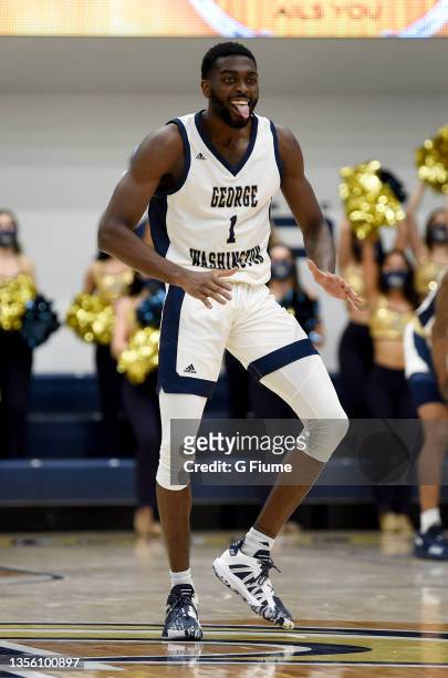 Joe Bamisile of the George Washington Colonials celebrates during the game against the St. Francis Red Flash at Charles E. Smith Athletic Center on...