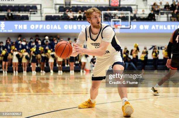 Hunter Dean of the George Washington Colonials handles the ball against the St. Francis Red Flash at Charles E. Smith Athletic Center on November 09,...