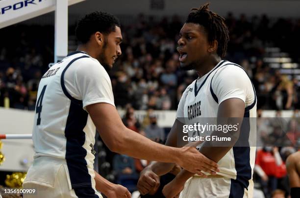 Noel Brown of the George Washington Colonials celebrates with Ricky Lindo Jr. #4 during the game against the St. Francis Red Flash at Charles E....