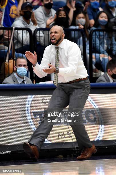 Head coach Jamion Christian of the George Washington Colonials watches the game against the St. Francis Red Flash at Charles E. Smith Athletic Center...