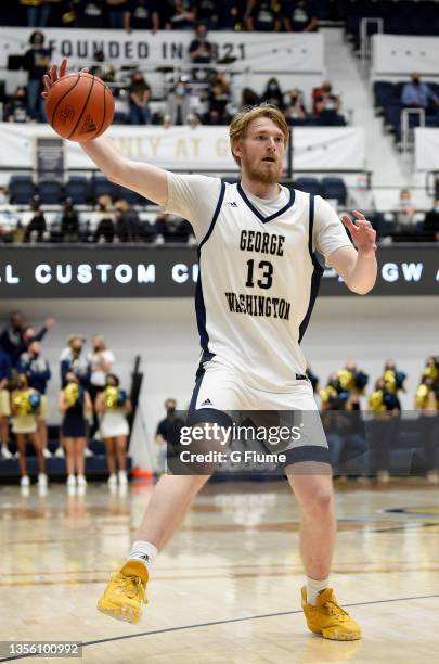 Hunter Dean of the George Washington Colonials handles the ball against the St. Francis Red Flash at Charles E. Smith Athletic Center on November 09,...