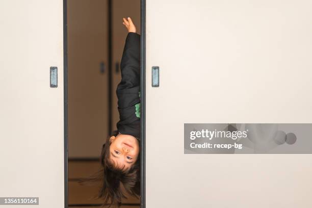 portrait of small multi-raced eurasian ethnic japanese boy dresses in japanese traditional clothing hakama for japanese traditional celebration called shichi go san - washitsu stock pictures, royalty-free photos & images