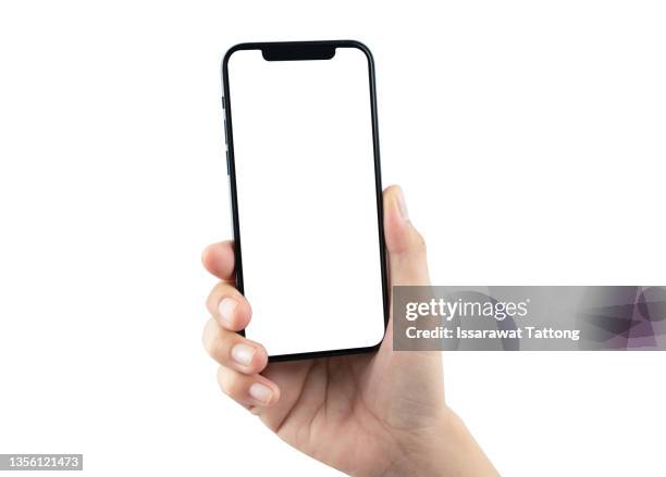 close up hand hold phone isolated on white background - féminin modèle photos et images de collection