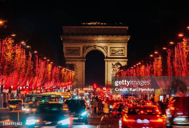 a night-time view of the champs-élysées paris, france - stock photo - champs elysees stock pictures, royalty-free photos & images