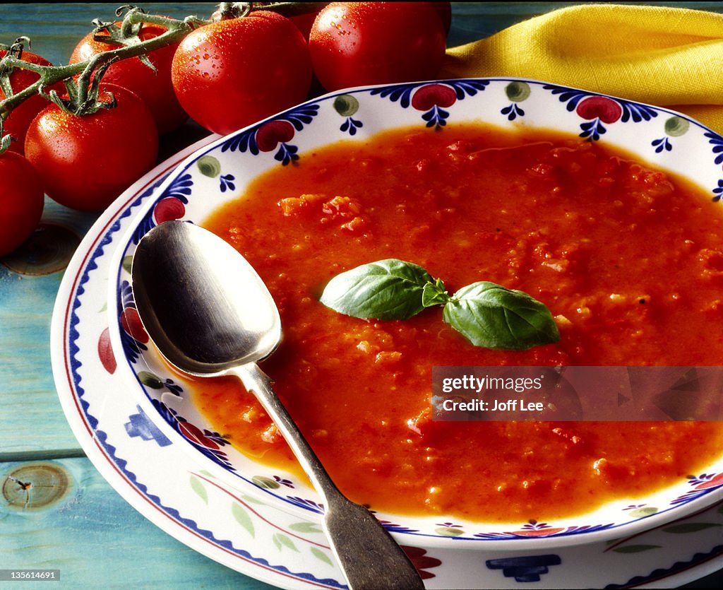 Bowl of tomato soup with basil