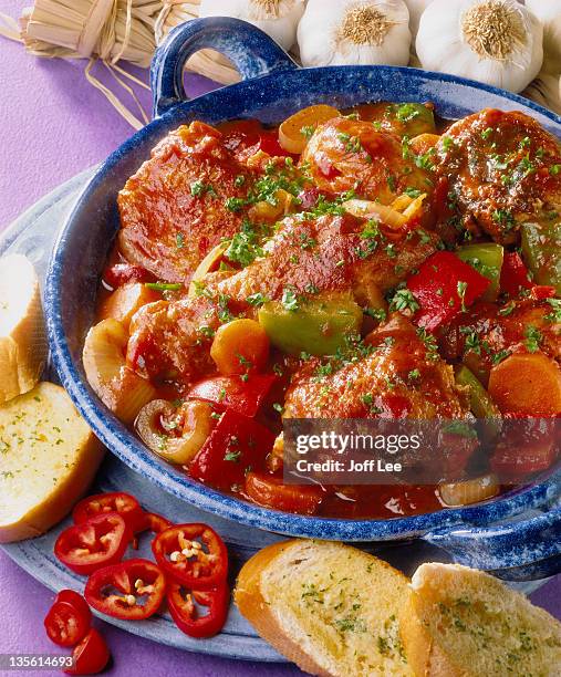 spicy chicken & garlic bread - casserole stock pictures, royalty-free photos & images