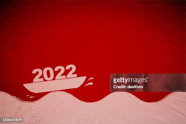 bright glowing comic or cartoon type christmas or new year vector red backgrounds with textured effect and rough scratches all over having a graffiti of one pale faded white boat or yacht sailing over tide of waves with text 2022 - 2022 a funny thing stock illustrations