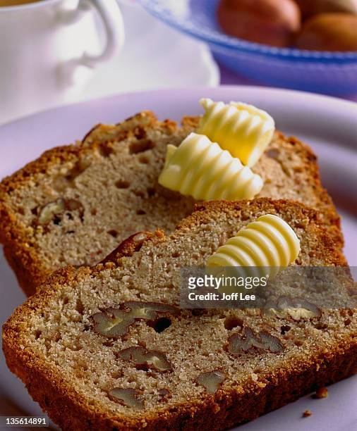 slices of pecan loaf with butter curls - butter curl stock pictures, royalty-free photos & images