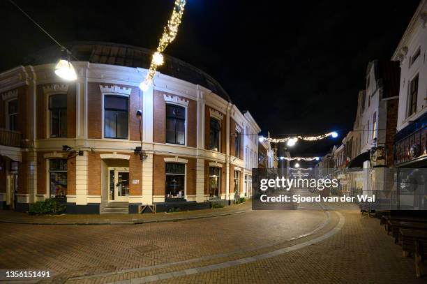 The view of a deserted street in the city center of Zwolle during the start of the evening lockdown after the Dutch government announced new measures...