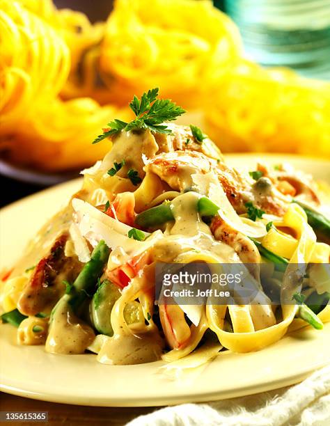 tagliatelle with creamy chicken & vegetable sauce - shaved cheese stock pictures, royalty-free photos & images