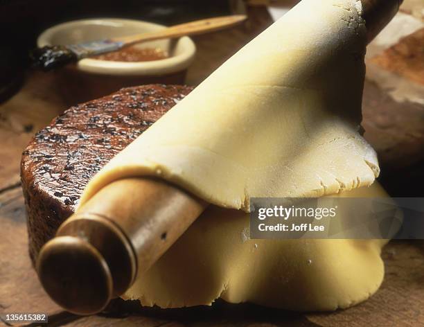 covering a cake with marzipan - marzipan stock pictures, royalty-free photos & images