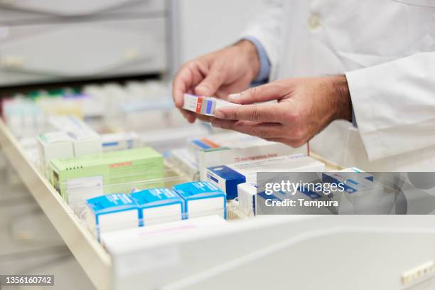 storing pills in a capsule medicine drawer in a pharmacy's backroom. - pharmacy stockfoto's en -beelden