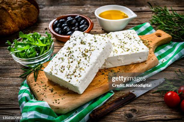 greek feta cheese, olives and aurugula - feta stock pictures, royalty-free photos & images