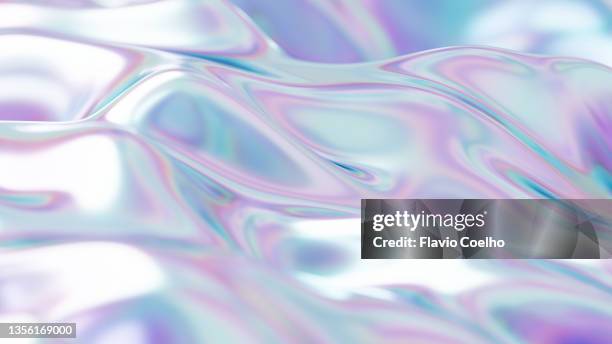 iridescent surface effect forming bright and smooth waves - holograma fotografías e imágenes de stock