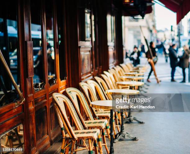 a daytime view of a paris cafe - stock photo - paris stock-fotos und bilder