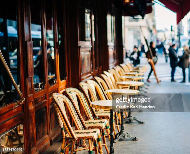 a daytime view of a paris cafe - stock photo - paris stock pictures, royalty-free photos & images