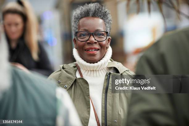 elderly woman with eyeglasses at station - east sussex stock-fotos und bilder