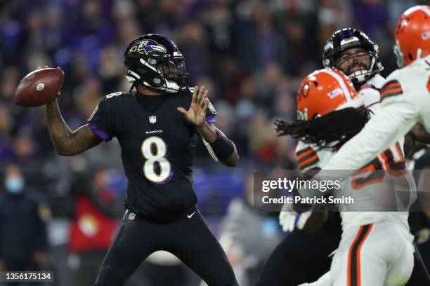 Quarterback Lamar Jackson of the Baltimore Ravens runs with the ball against the Cleveland Browns at M&T Bank Stadium on November 28, 2021 in...