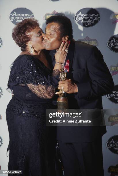 American singer and guitarist Charley Pride and his wife, Rozene Pride, in the press room of the 29th Annual Academy of Country Music Awards, held at...