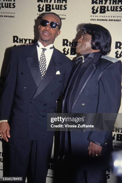 American rapper MC Hammer and American singer and musician James Brown attend Rhythm & Blues Foundation Pioneer Awards, held at the Palace Theater in...