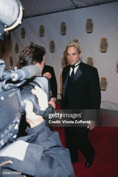 American baseball player Mike Piazza interviewed by an unspecified interviewer at the Sports Illustrated's 20th Century Sports Awards, held at...