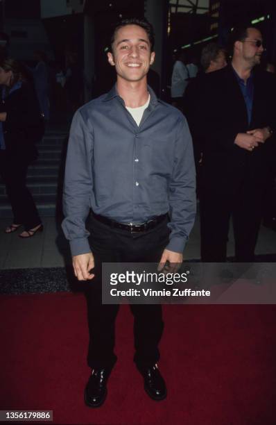 American actor Thomas Ian Nicholas, wearing a grey shirt over a white t-shirt with black trousers, attends Movieline Magazine's 2nd Annual Young...
