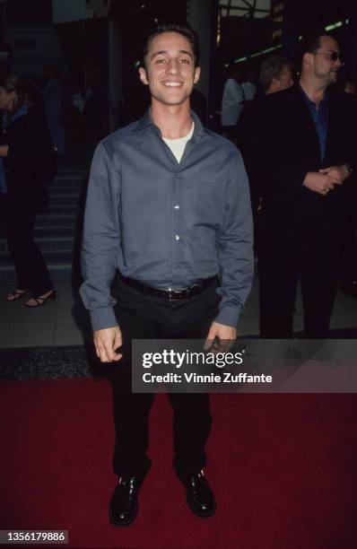 American actor Thomas Ian Nicholas, wearing a grey shirt over a white t-shirt with black trousers, attends Movieline Magazine's 2nd Annual Young...