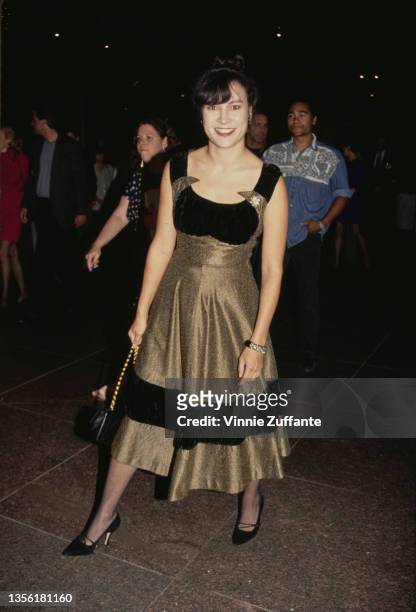 American-Canadian actress Jennifer Tilly, wearing a gold-and-black evening gown, attends the West Hollywood premiere of 'Incident at Oglala' held at...