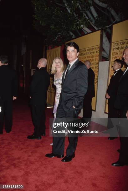 American actor Peter Gallagher and his wife, Paula Harwood, attend the Elton John AIDS Foundation and InStyle Oscar Party in Los Angeles, California,...