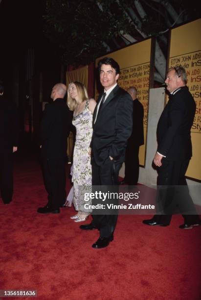 American actor Peter Gallagher and his wife, Paula Harwood, attend the Elton John AIDS Foundation and InStyle Oscar Party in Los Angeles, California,...