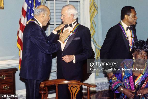 Kennedy Center honorees Hungarian-born British conductor Georg Solti and American television host & comedian Johnny Carson talk together following...