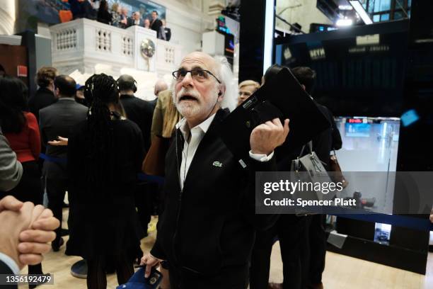 Stock trader Peter Tuchman works on the floor of the New York Stock Exchange at the start of trading on Monday following Friday’s steep decline in...