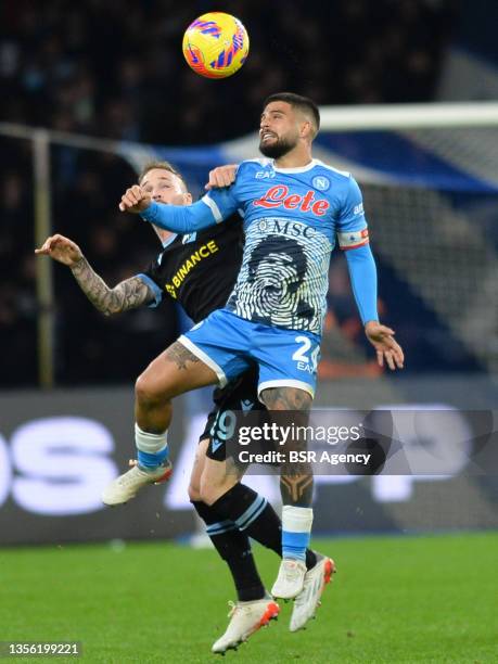 Manuel Lazzari of SS Lazio battles for the ball with Lorenzo Insigne of SSC Napoli during the Serie A TIM match between SSC Napoli and Lazio Roma at...