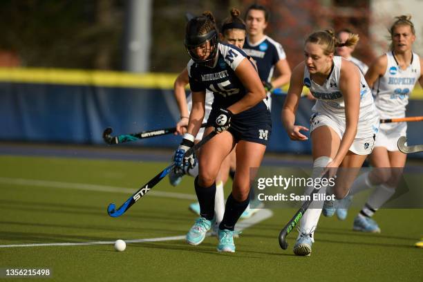 Erin Nicholas of the Middlebury Panthers handles the ball against Olivia Fox of the Johns Hopkins Blue Jays during the Division III Women’s Field...