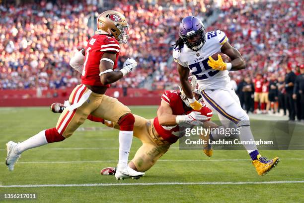 Alexander Mattison of the Minnesota Vikings runs with the ball for a rushing touchdown against the San Francisco 49ers in the third quarter at Levi's...