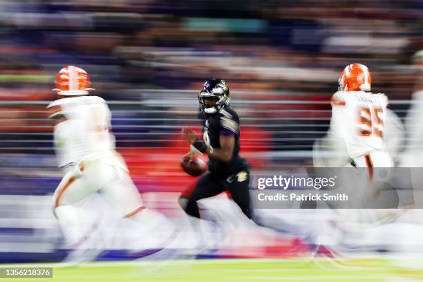 Lamar Jackson of the Baltimore Ravens scrambles during a game against the Cleveland Browns at M&T Bank Stadium on November 28, 2021 in Baltimore,...