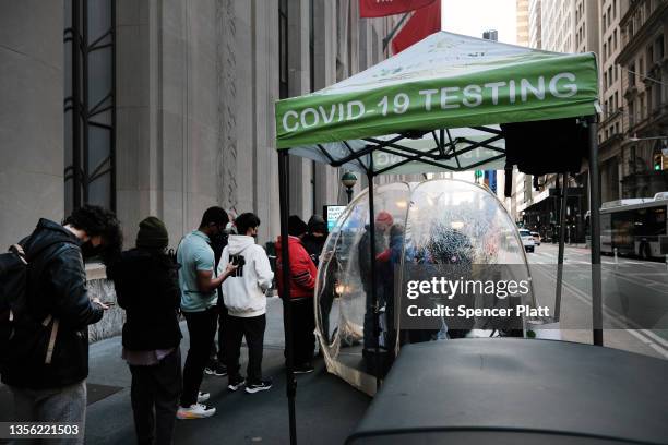 People line-up to take a Covid test at a site in Manhattan on November 29, 2021 in New York City. Across New York City and the nation, people are...