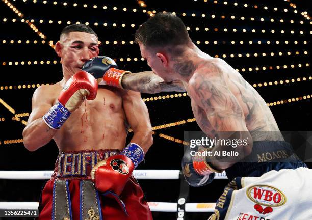 George Kambosos punches Teofimo Lopez during their championship bout for Lopez’s Undisputed Lightweight title at The Hulu Theater at Madison Square...