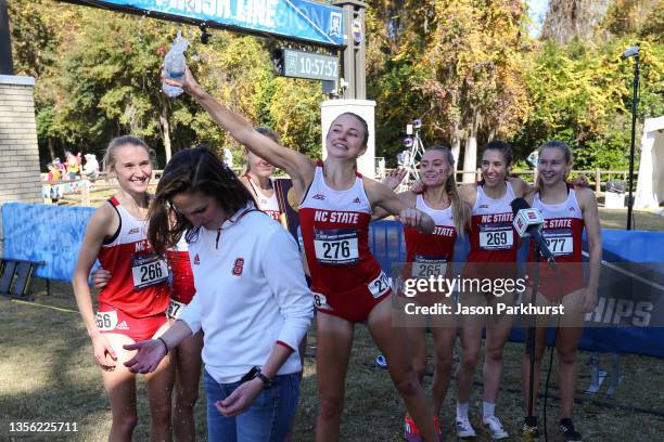 State runners celebrate after winning the Division I Women's Cross Country Team Championship held at Apalachee Regional Park on November 20, 2021 in...