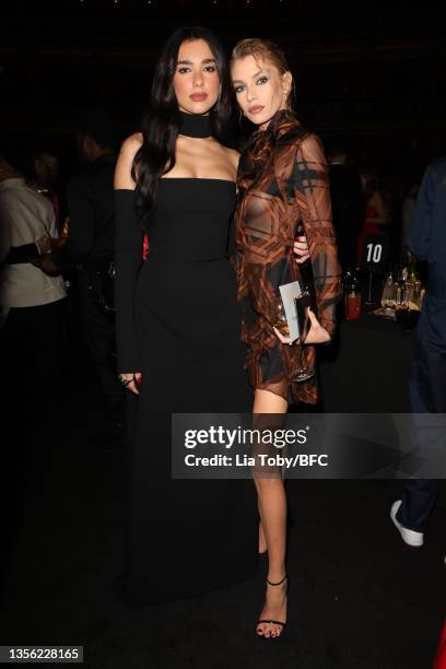 Dua Lipa and Stella Maxwell attend The Fashion Awards 2021 at Royal Albert Hall on November 29, 2021 in London, England.