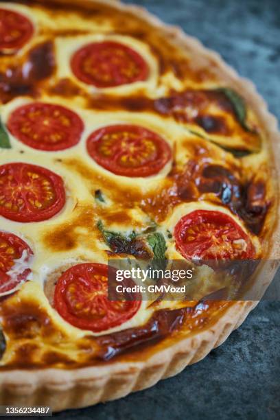 fresh baked quiche with tomatoes and basil - tomato pie stock pictures, royalty-free photos & images