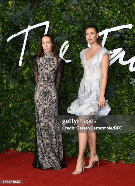 Designer Iris Van Herpen and Maria Sharapova, wearing a dress made from recycled plastic bottles, designed by Iris Van Herpen, at The Fashion Awards...