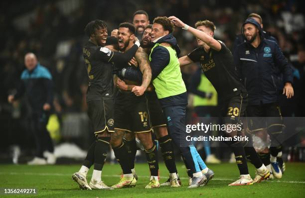 Andre Gray of Queens Park Rangers celebrates after he scores during the Sky Bet Championship match between Derby County and Queens Park Rangers at...
